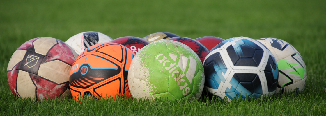 pile of soccer balls